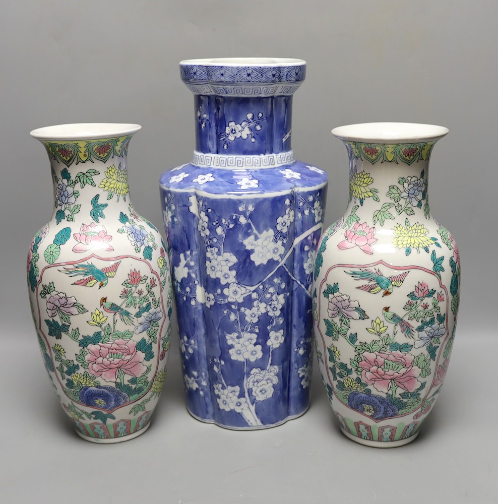 A pair of Chinese enamelled porcelain baluster vases and a Chinese blue and white vase. 37cm